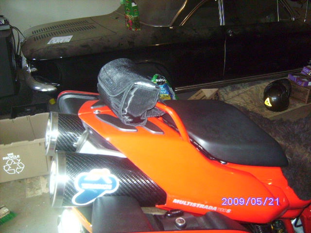 perfict size,hides gps,tank bag,even helment on seat,dry too