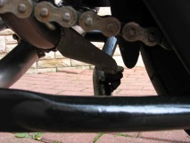 Cat by-pass pipe - centre stand stop