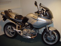 Custom seat and cowl with monster mirrors.